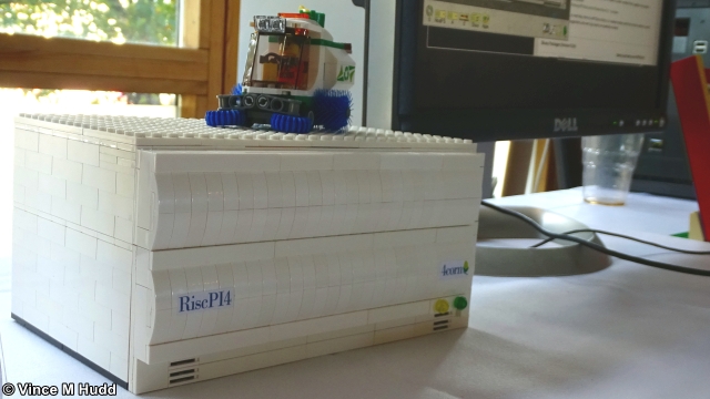 A two slice lego RiscPI4 case on the RPCEMu stand at London 2021