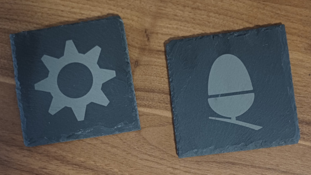Welsh slate coasters engraved with either the RISC OS cog, or an acorn